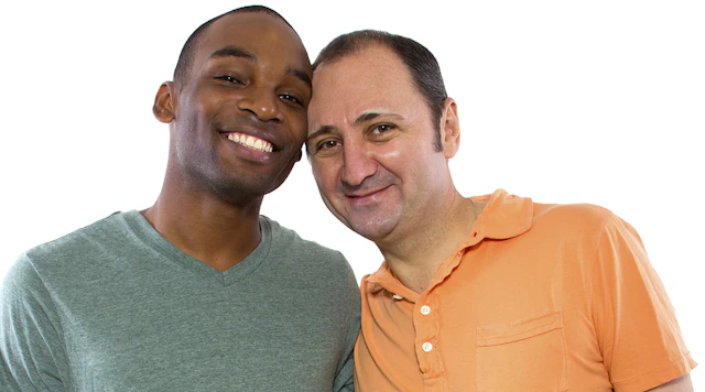 Image of an inter-racial gay couple. Black man on the left and a white man on the right.