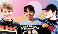 Three younger male presenting individuals holding signs