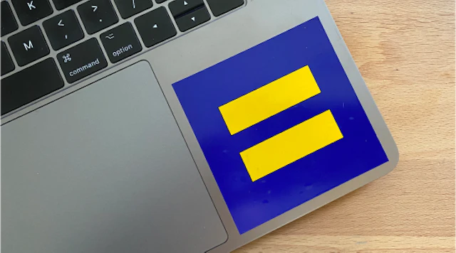 An HRC logo sticker on the corner of a laptop.
