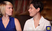 Two women looking at each other while talking