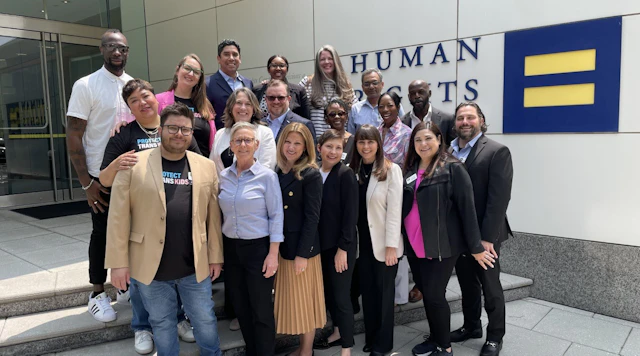 Photo of the 2023 PTEC Parents for Transgender Equality National Council standing in front of HRC headquarters.
