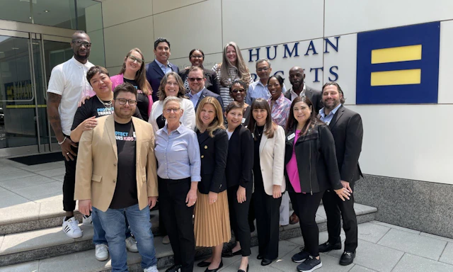 Photo of the 2023 PTEC Parents for Transgender Equality National Council standing in front of HRC headquarters.
