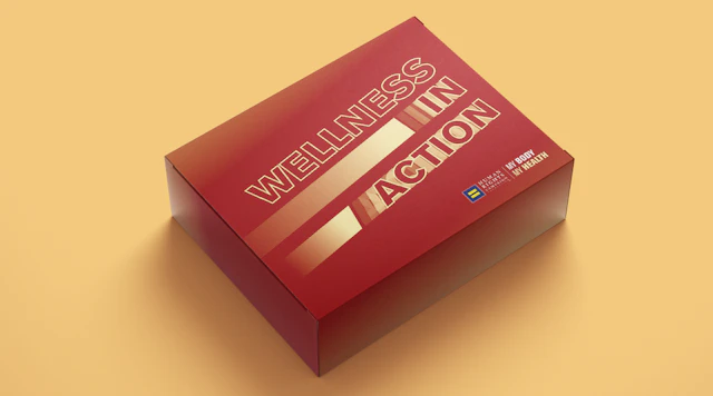 Red box with gold lettering that reads "WELLNESS IN ACTION" in all caps with the HRC equality logo in the bottom right corner of the box.