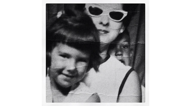 Joni Madison as a young girl and her mom in a photo booth